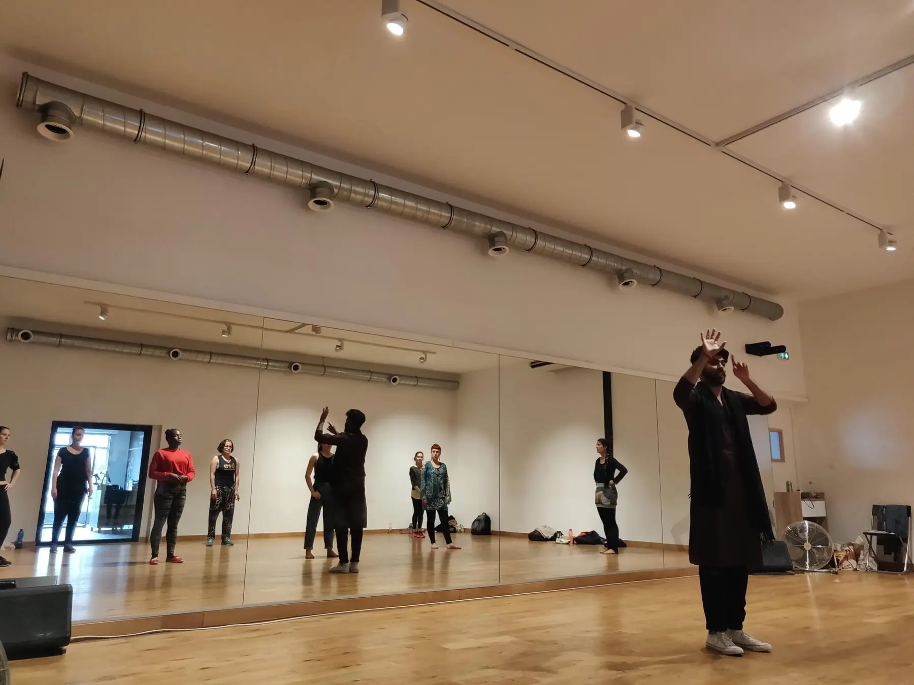 Harshit teaching in a dance studio
