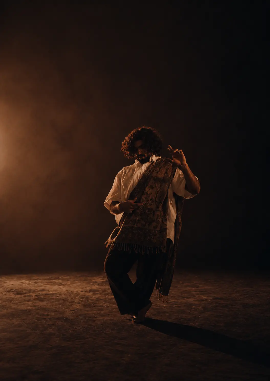Solo movement in warm stage light