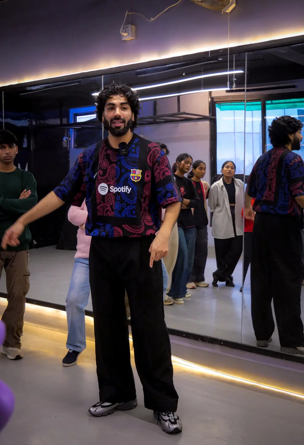 Harshit guiding students in a dance studio